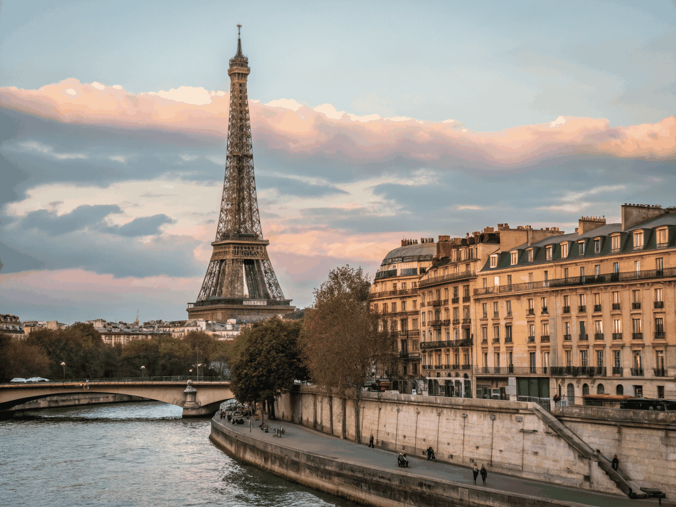 Classic Haussmann buildings and the Seine river with the Eiffel Tower in the distance