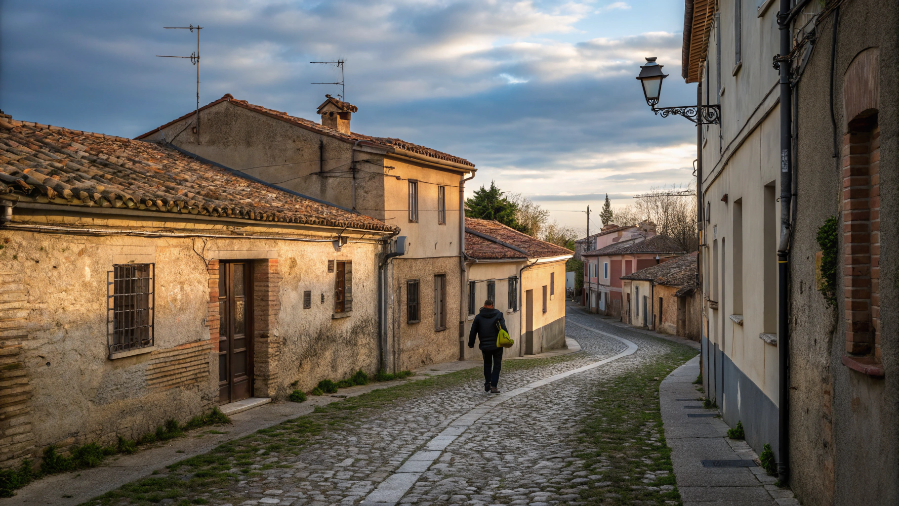Historic European cobblestone alleyway in warm morning light
