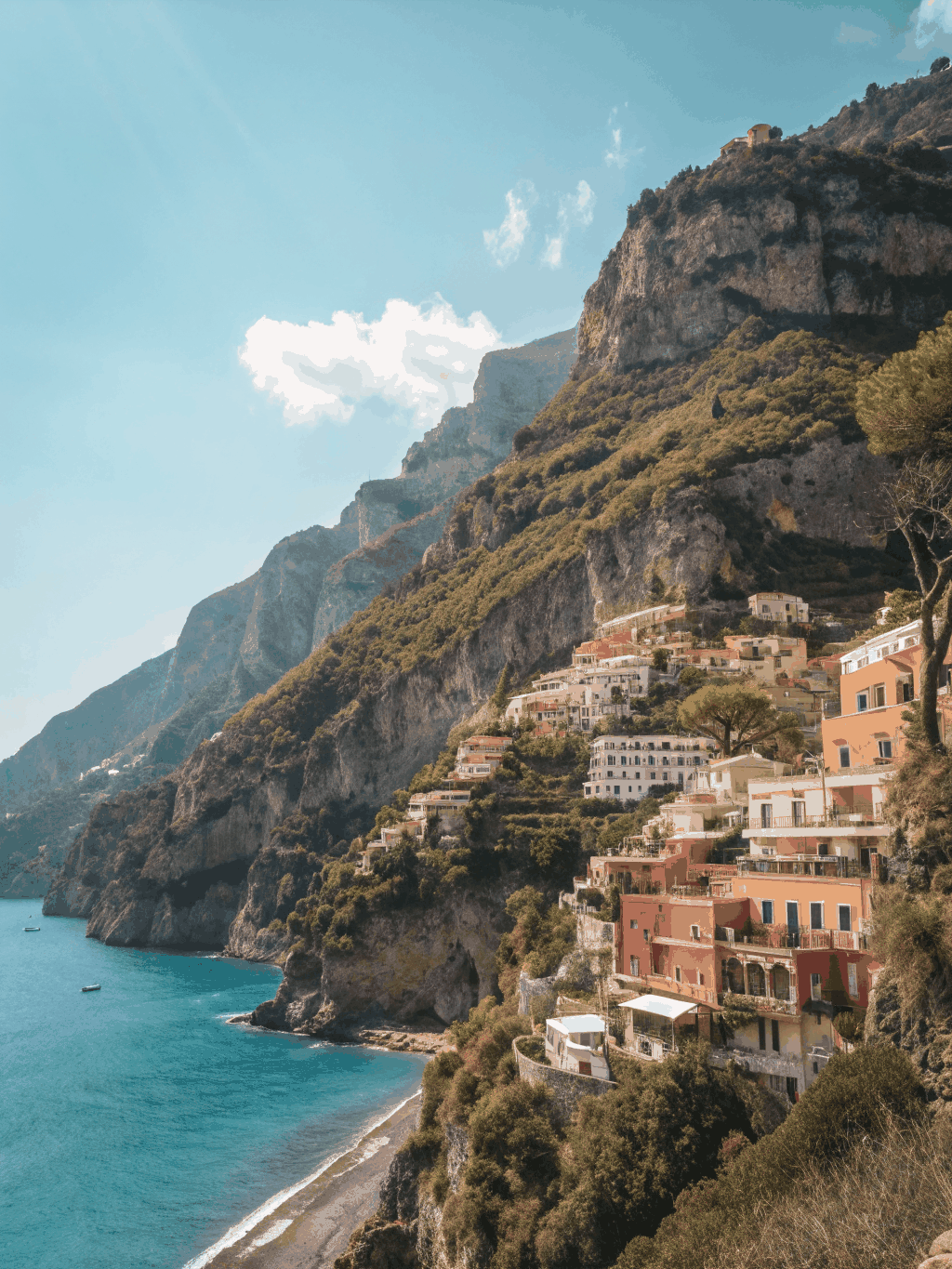 Pastel Italian villas cascading down rugged cliffs to the sea along the Amalfi Coast