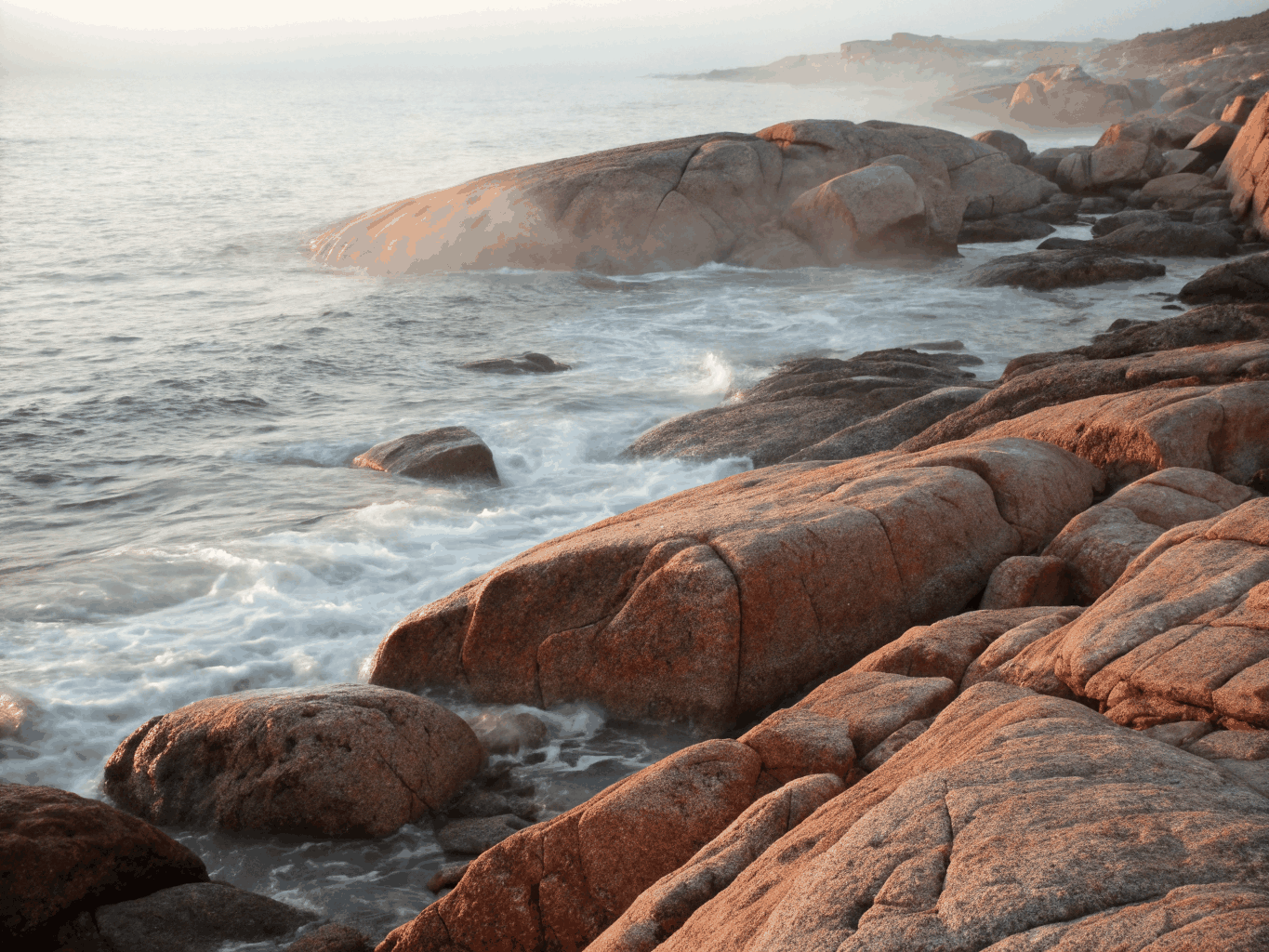 Pink granite rocks sculpted by the sea on the Brittany coast