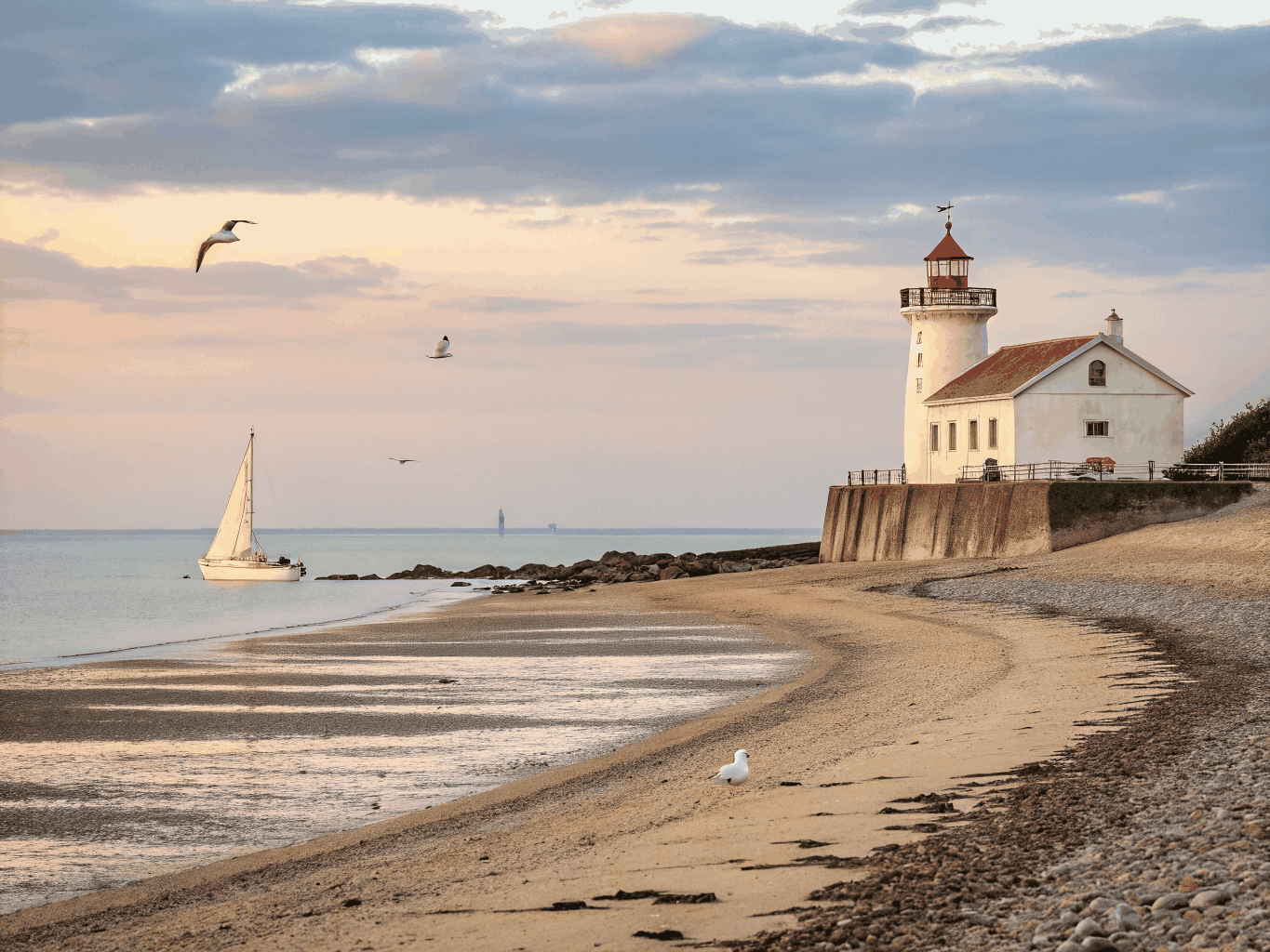 Lighthouse on a rocky headland along the wild Normandy coast