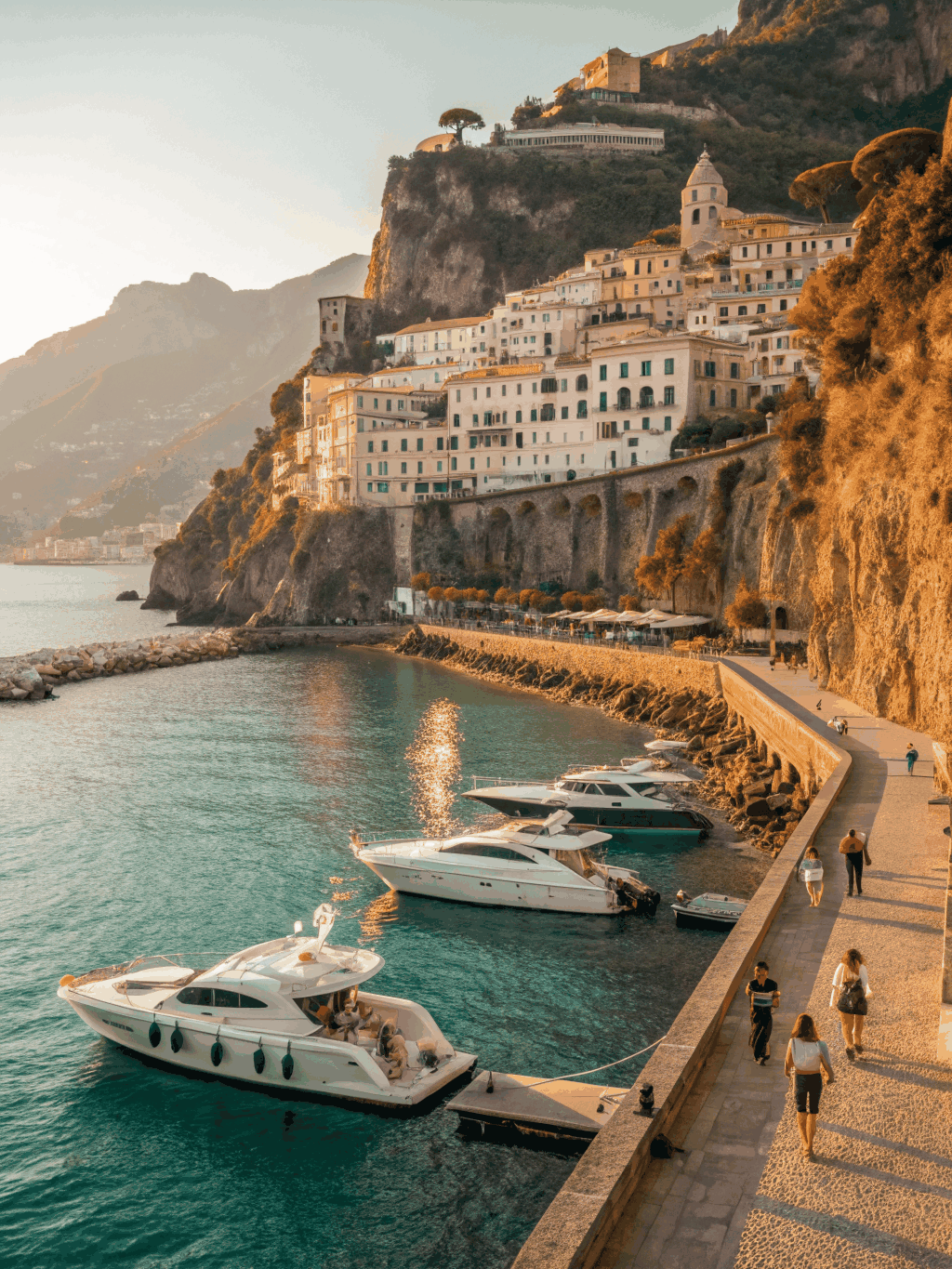 Colorful pastel waterfront houses and wooden yachts moored in the picturesque natural bay of Portofino