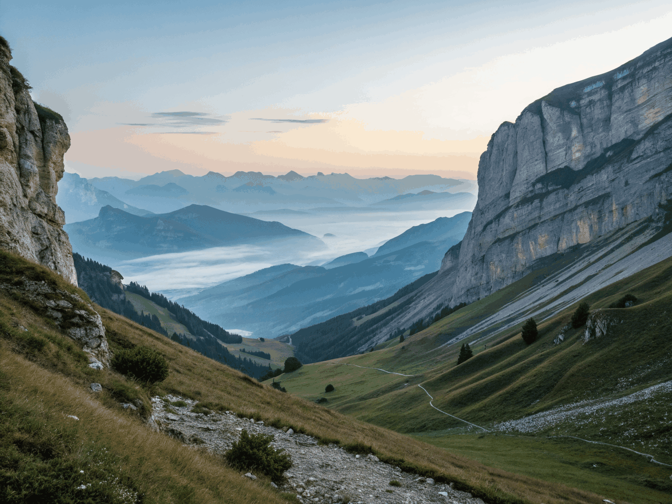 Green valley below towering alpine cliffs and waterfalls in Switzerland