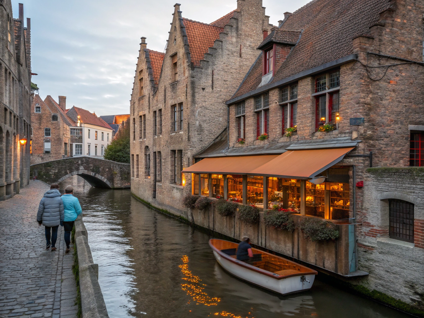 Reflections of Flemish stepped gables in the calm canal water of Bruges