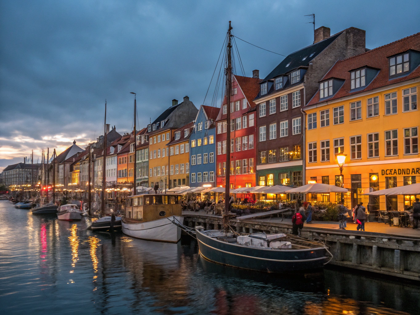 Brightly colored 17th-century townhouses and historic boats along Nyhavn canal
