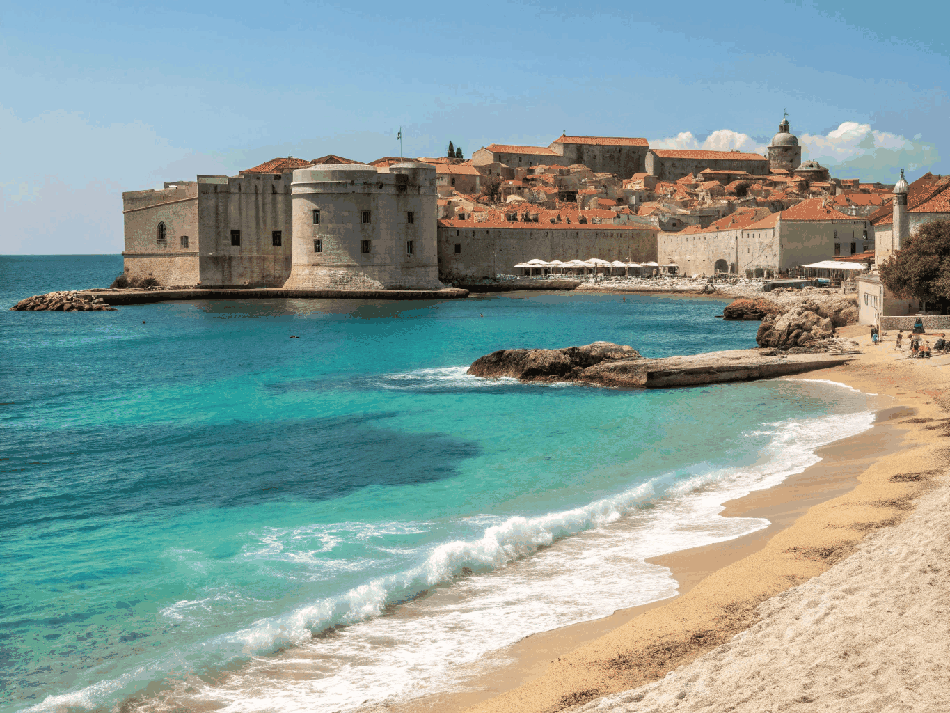 Terracotta rooftops of Dubrovnik bordered by medieval sea fortifications