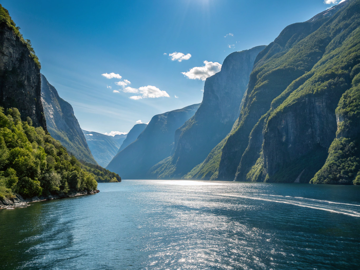 Deep emerald waters of Geirangerfjord framed by towering rock faces