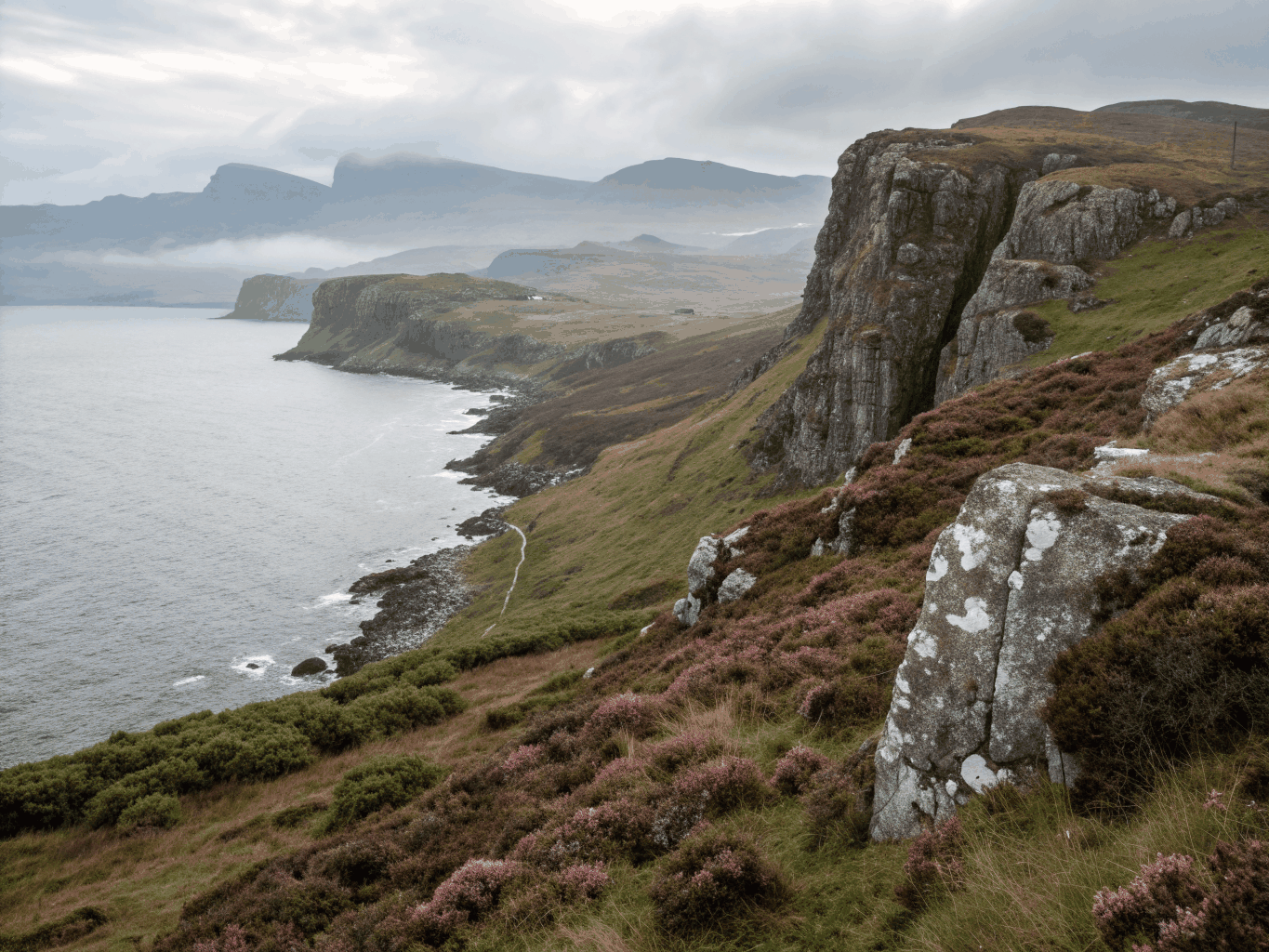 Dramatic grassy pinnacles of the Quiraing under soft Scottish morning light