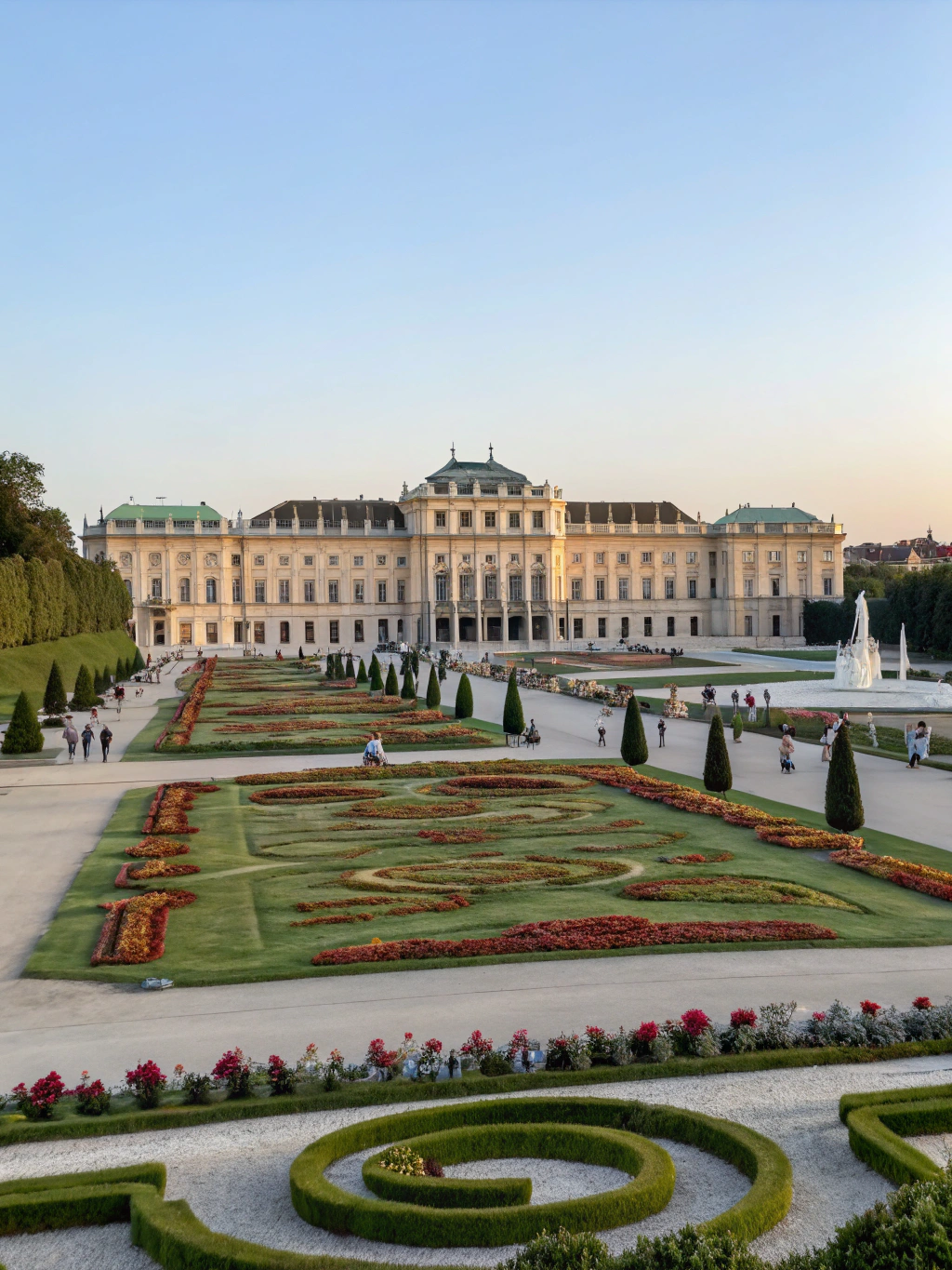 Magnificent yellow baroque facade of Schönbrunn Palace flanked by symmetrical landscaped gardens in Vienna