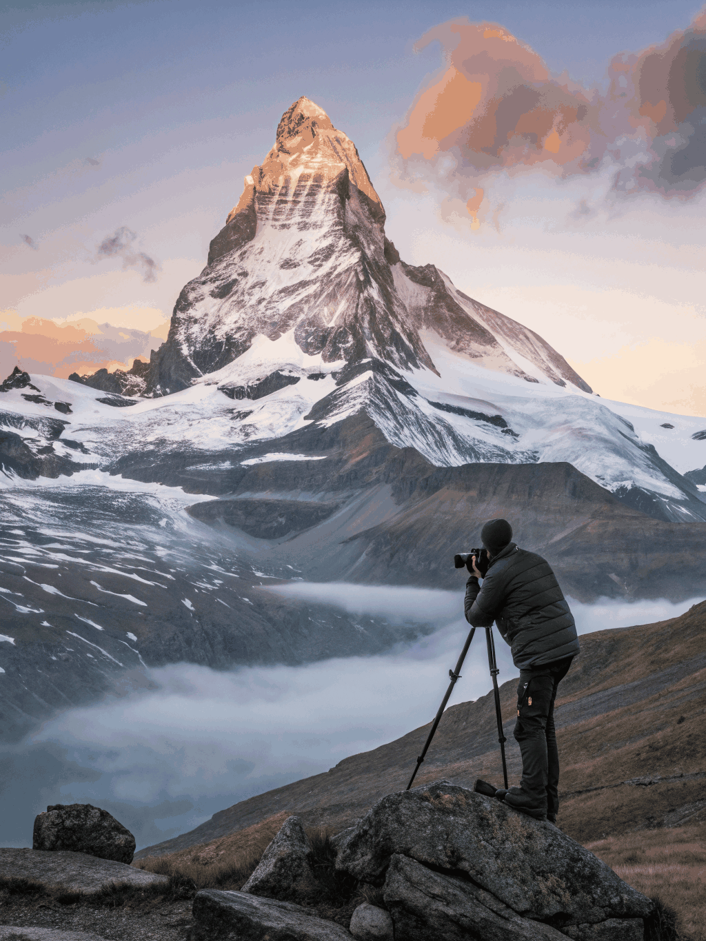 The sharp pyramid peak of the Matterhorn reflected in an alpine tarn