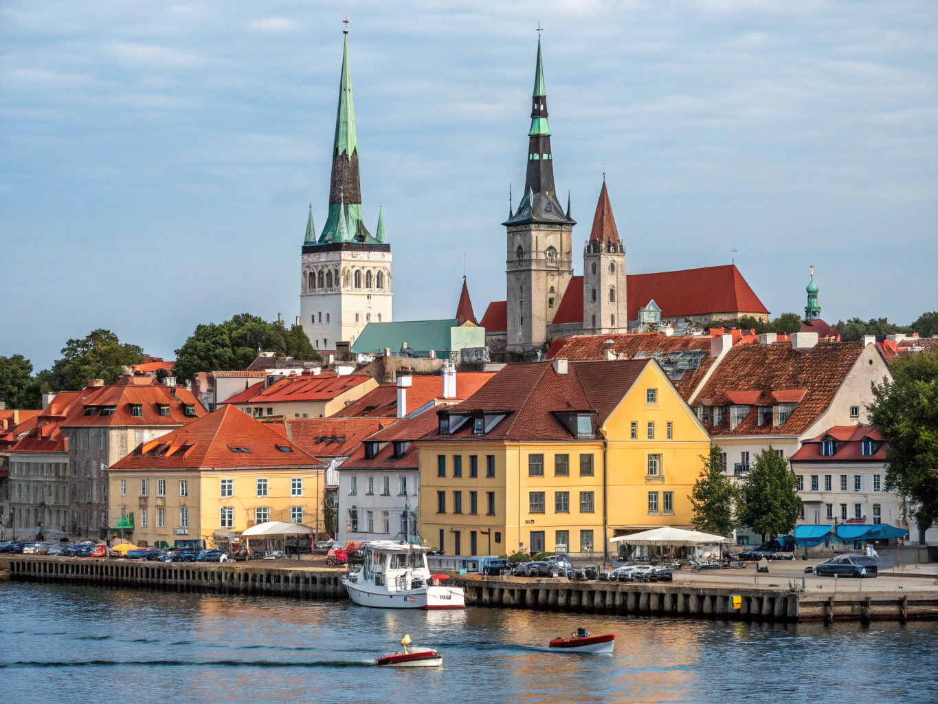 Medieval red-roofed stone watchtowers and church spires of Tallinn Old Town