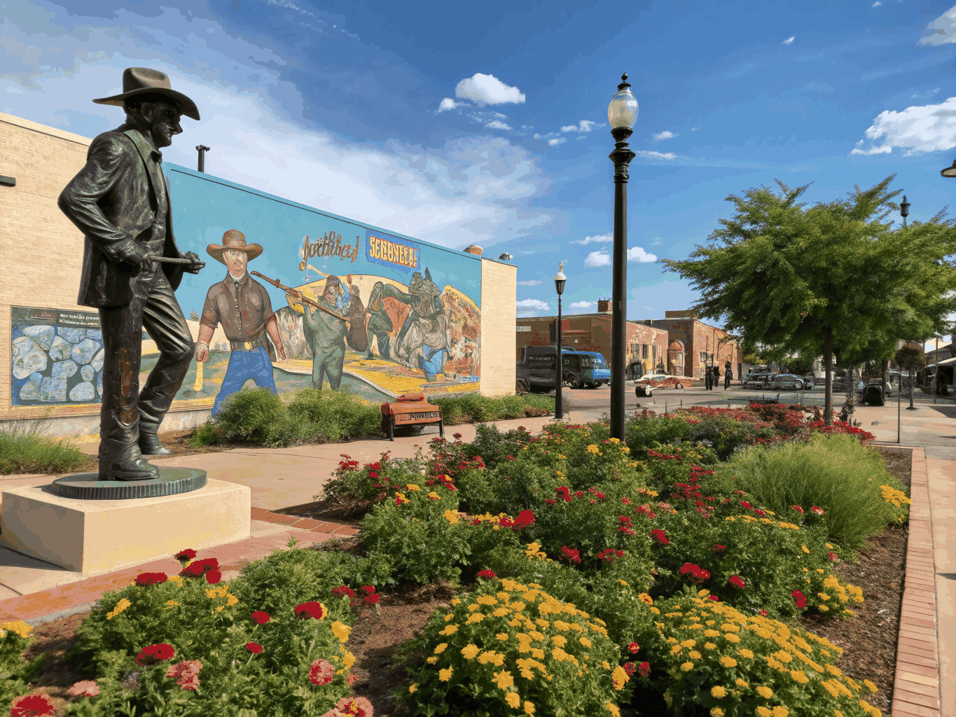 Standin on the Corner park in Winslow Arizona featuring Route 66 street insignia and bronze statue