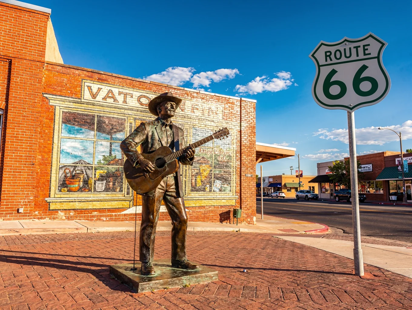 Standin on the Corner park in Winslow Arizona featuring Route 66 street insignia and bronze statue
