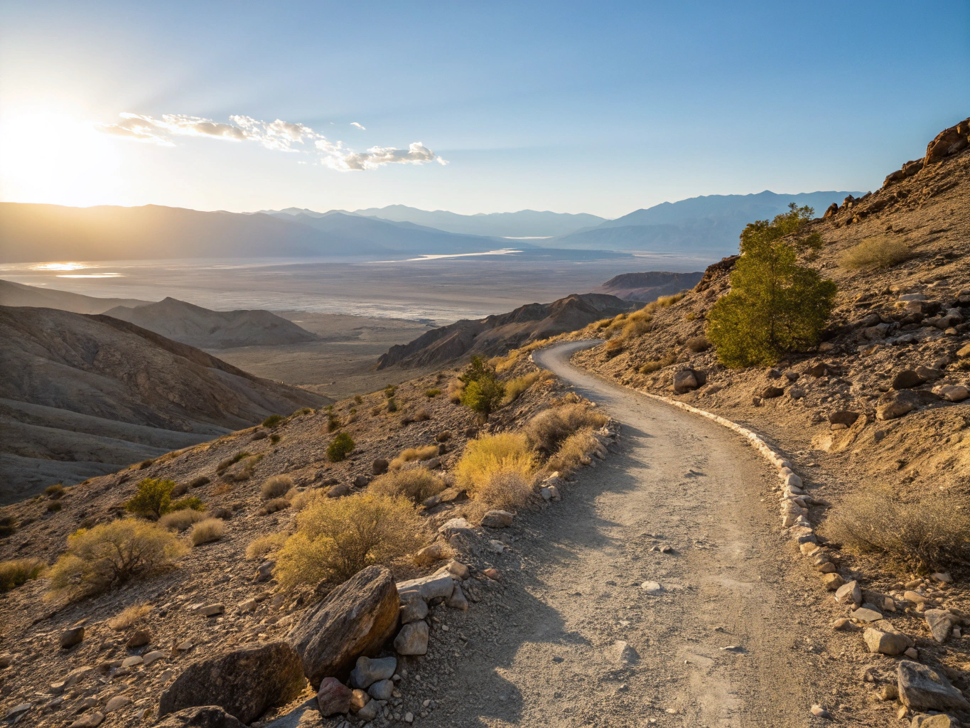 Panoramic highway vista overlooking red rock mesas and open desert landscape