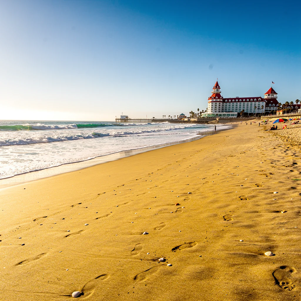 Wide shimmering sands and gentle surf of Coronado Beach