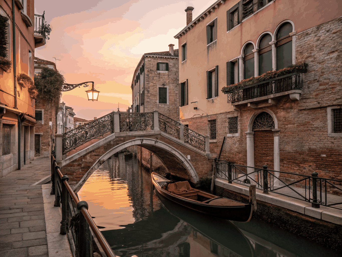 Serene Venetian canal in Cannaregio with small wooden watercraft
